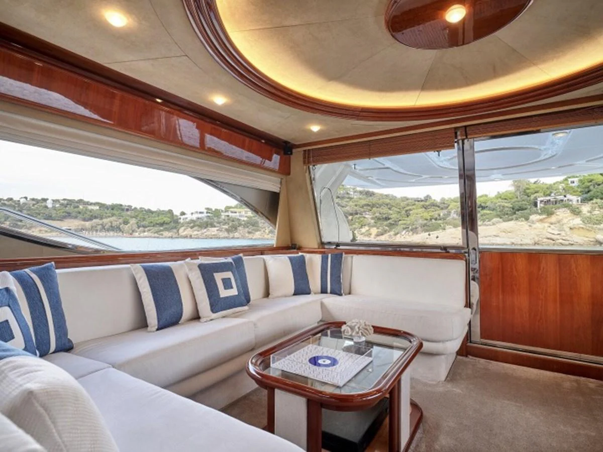 a living room with a large window aboard MIREN Yacht for Sale