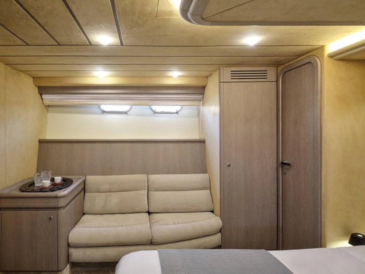 a room with a couch and a table aboard MIREN Yacht for Sale