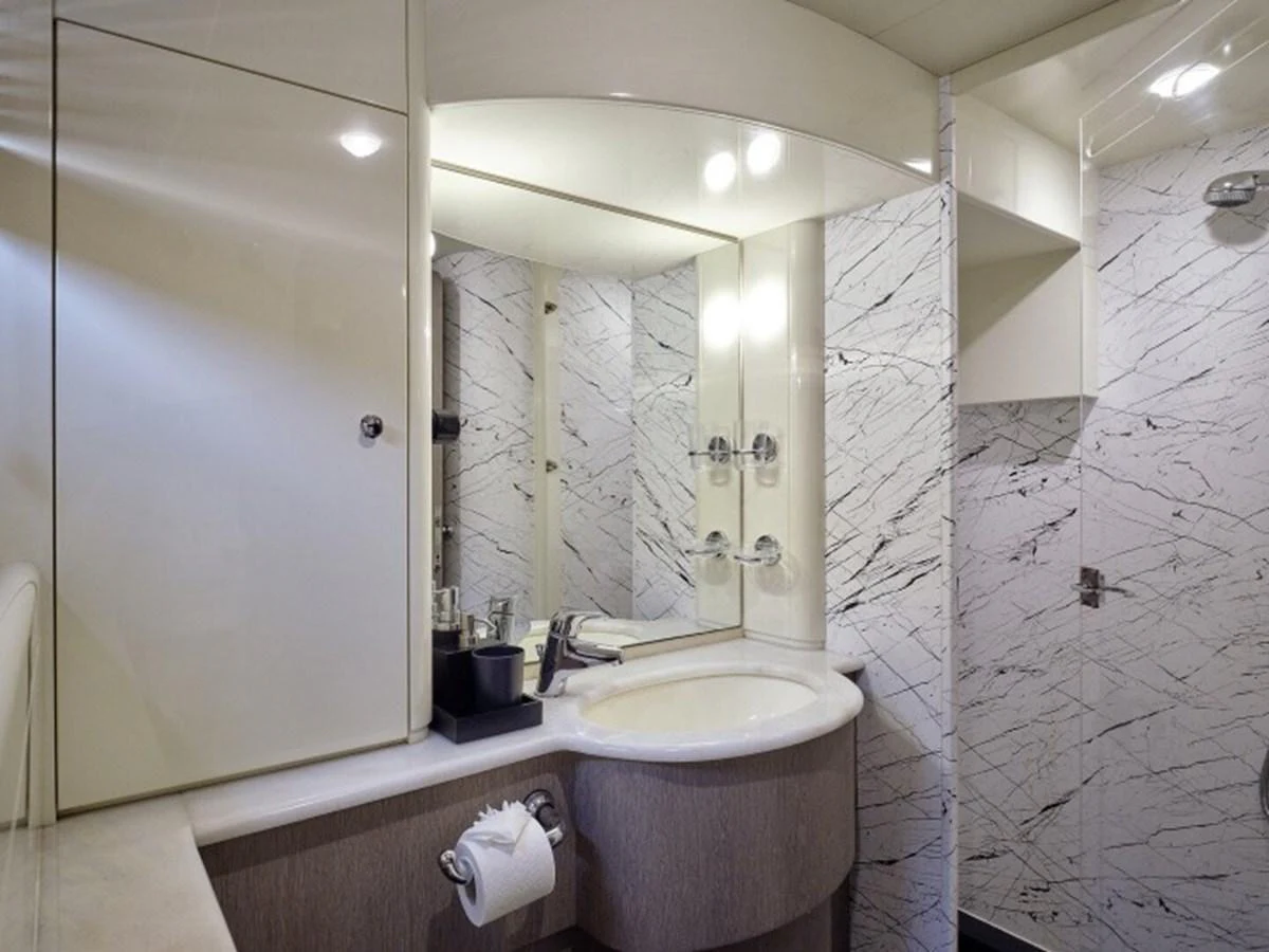 a bathroom with a large mirror aboard MIREN Yacht for Sale