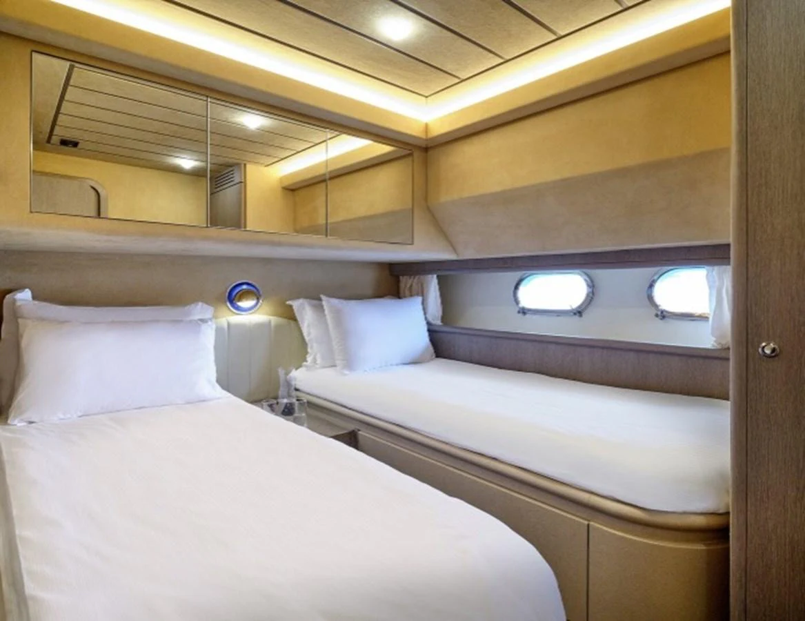 a room with two beds aboard MIREN Yacht for Sale
