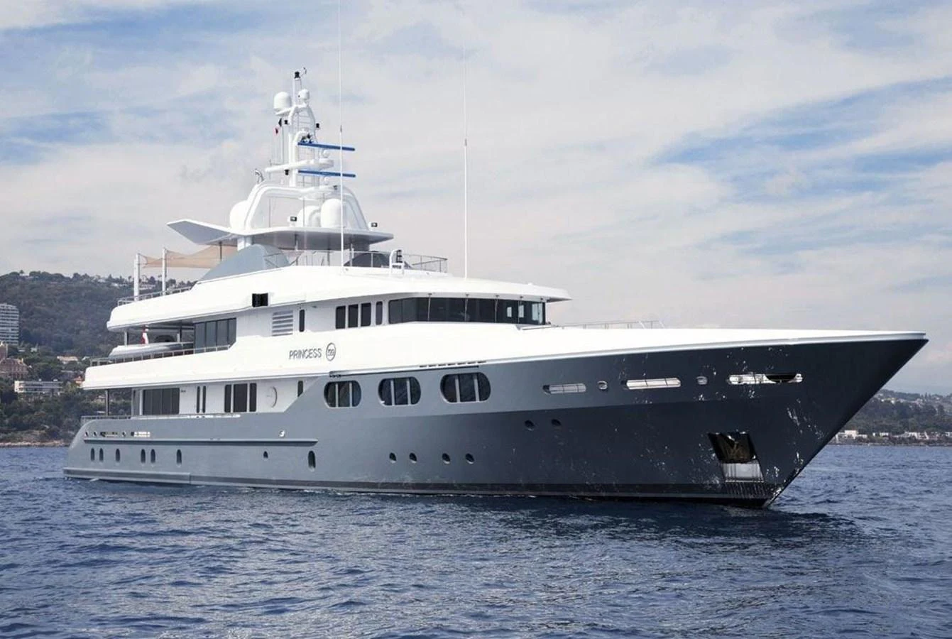 A sleek and modern yacht glides gracefully on calm waters, showcasing its elegant design and luxurious features. aboard PRINCESS TOO Yacht for Sale