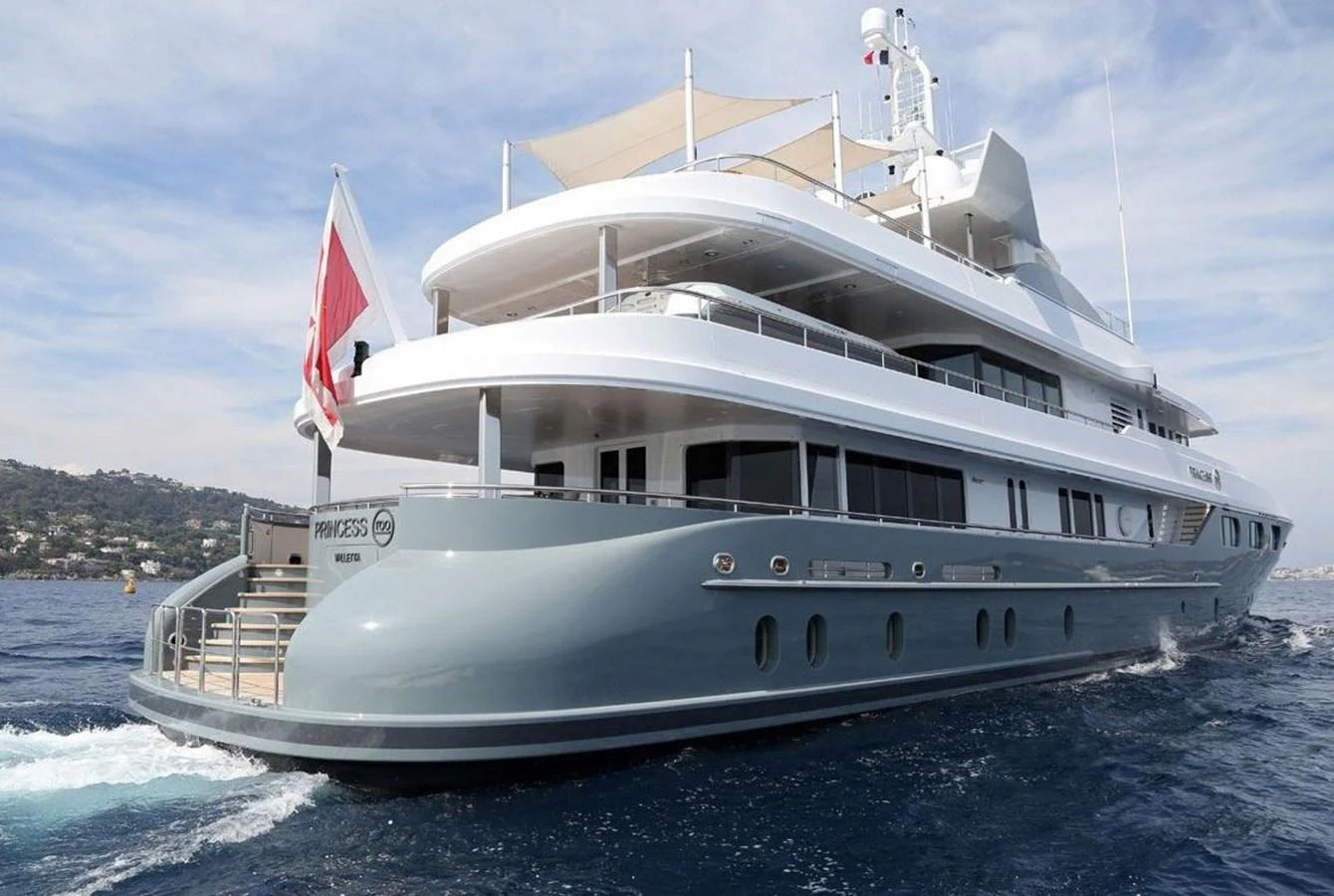 A luxurious yacht glides through the water, showcasing its sleek design and multiple decks. aboard PRINCESS TOO Yacht for Sale