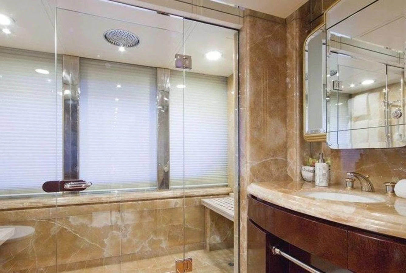 The yacht's bathroom features luxurious marble finishes and modern fixtures. aboard PRINCESS TOO Yacht for Sale