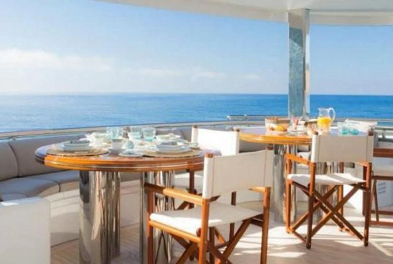 The yacht features a beautiful alfresco dining area with stunning ocean views. aboard PRINCESS TOO Yacht for Sale