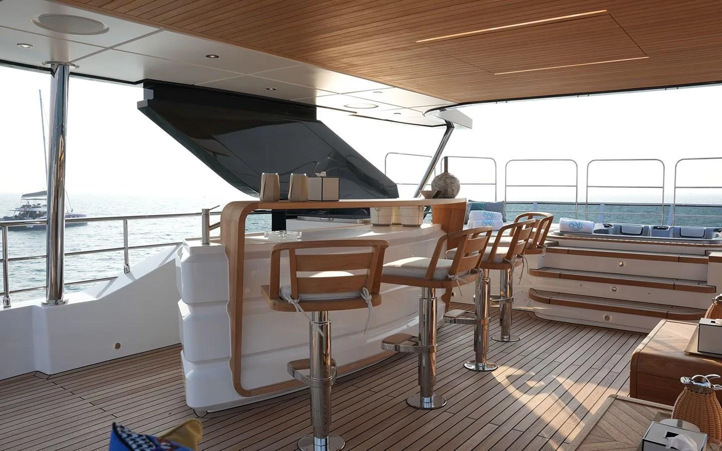 The yacht features a stylish bar area with comfortable seating and a view of the sea. aboard GEULUNEL Yacht for Sale