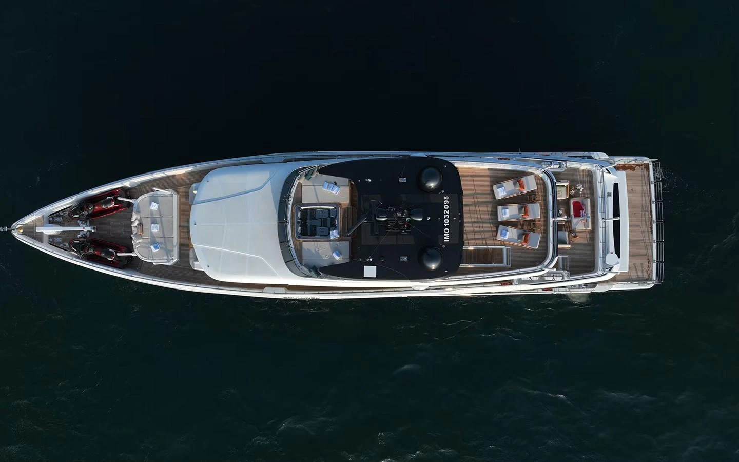 Aerial view of a sleek and luxurious yacht cruising on the water. aboard GEULUNEL Yacht for Sale