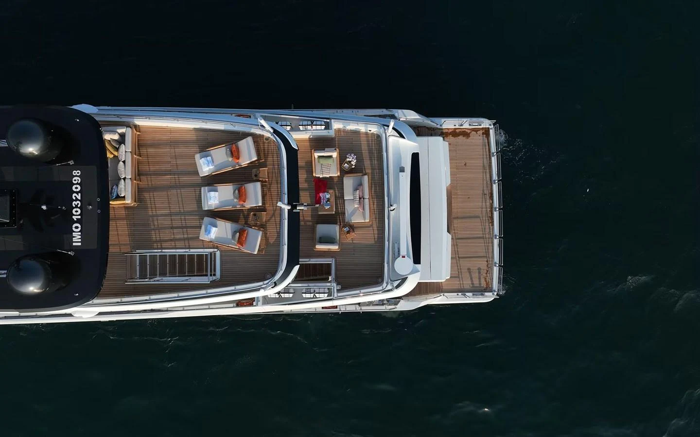 The yacht's aft deck features a stylish outdoor seating and lounging area, perfect for relaxation and entertainment. aboard GEULUNEL Yacht for Sale