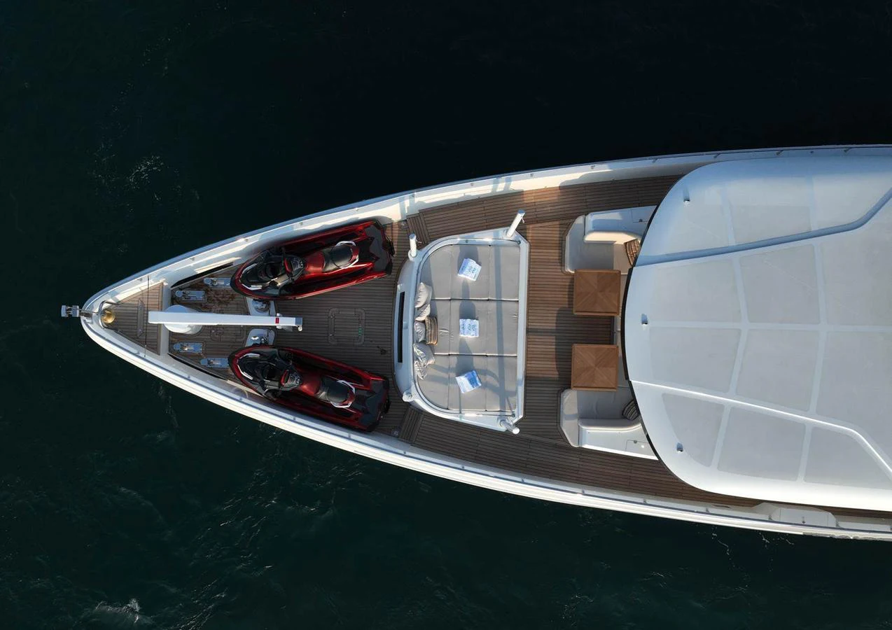 The bow of the yacht features a spacious deck with seating and two jet skis. aboard GEULUNEL Yacht for Sale