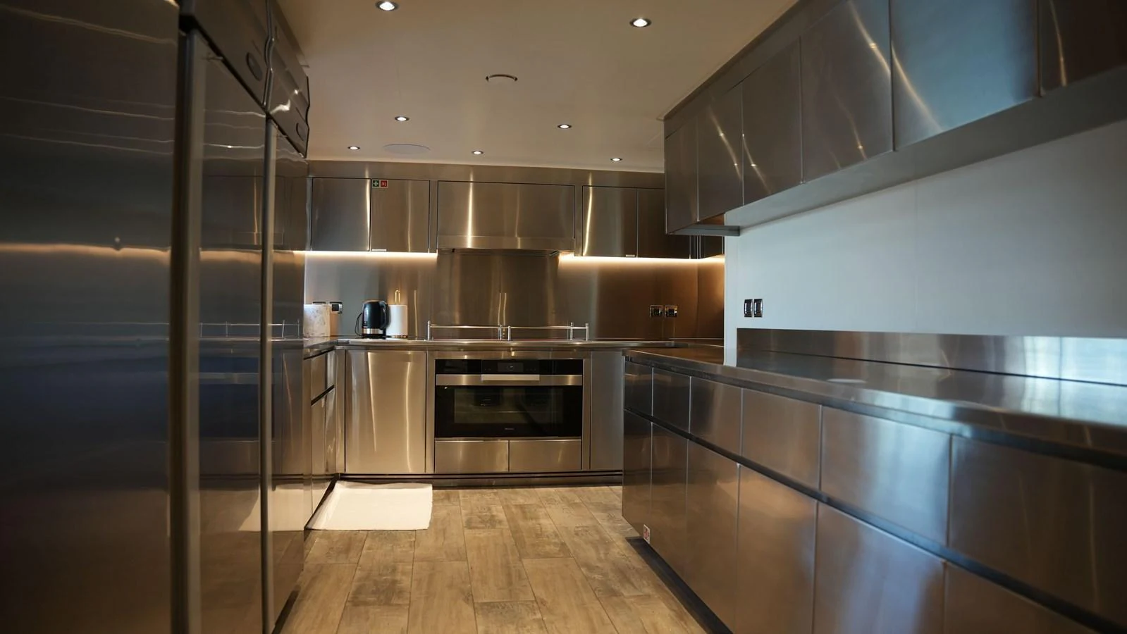 The yacht's galley features sleek stainless steel appliances and ample counter space, creating a modern and functional cooking area. aboard GEULUNEL Yacht for Sale