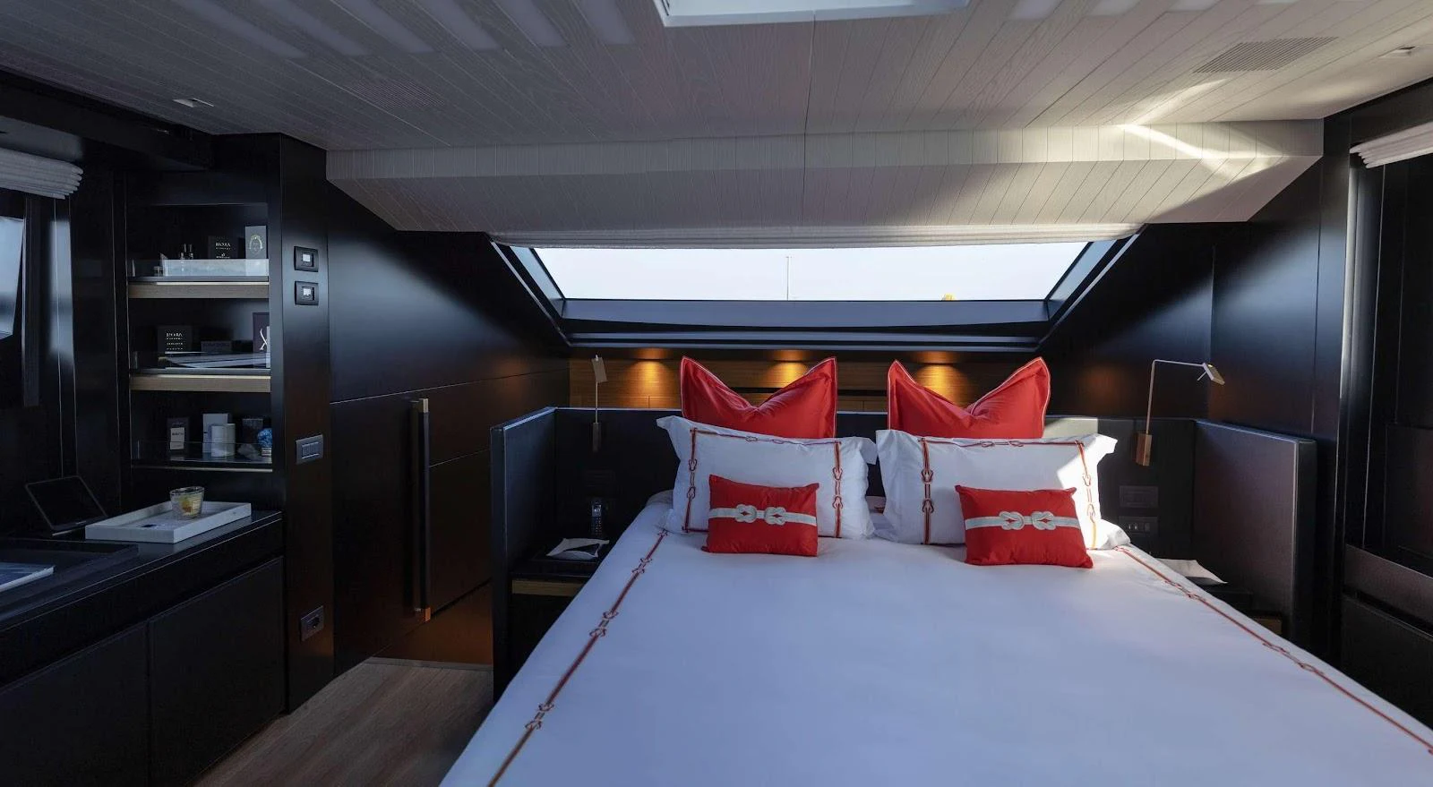 The master stateroom features a luxurious bed with elegant decor and ample natural light. aboard SOLEDO Yacht for Sale