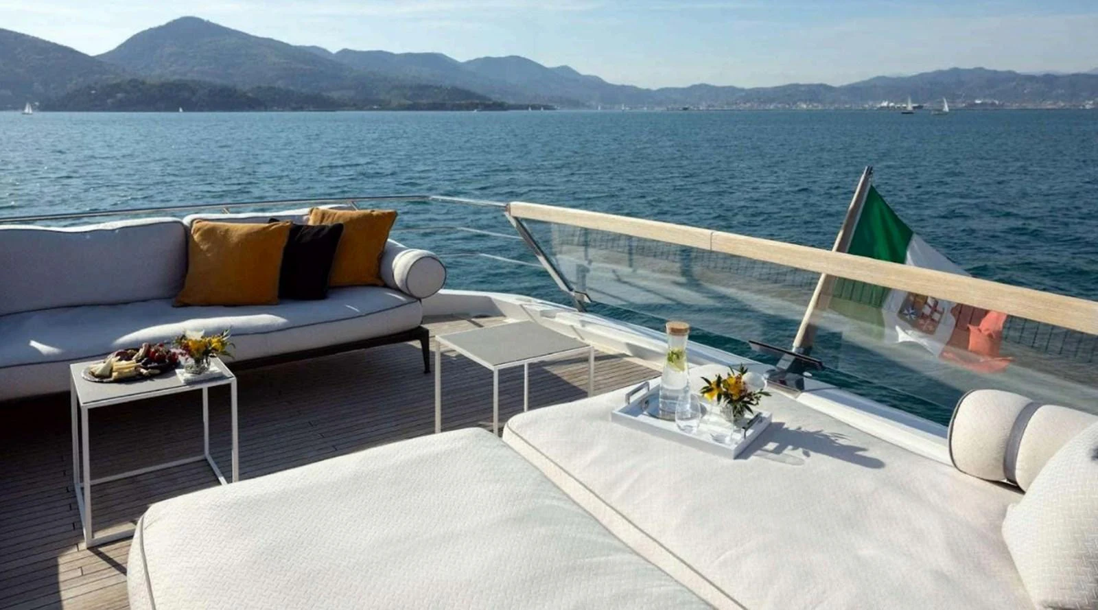 The aft deck offers a luxurious lounging area with comfortable seating and stunning sea views. aboard SOLEDO Yacht for Sale