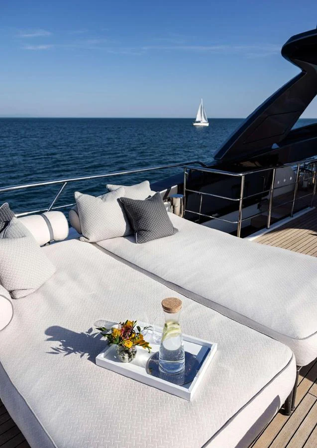 The sundeck offers luxurious lounging with plush cushions and a serene ocean view. aboard SOLEDO Yacht for Sale