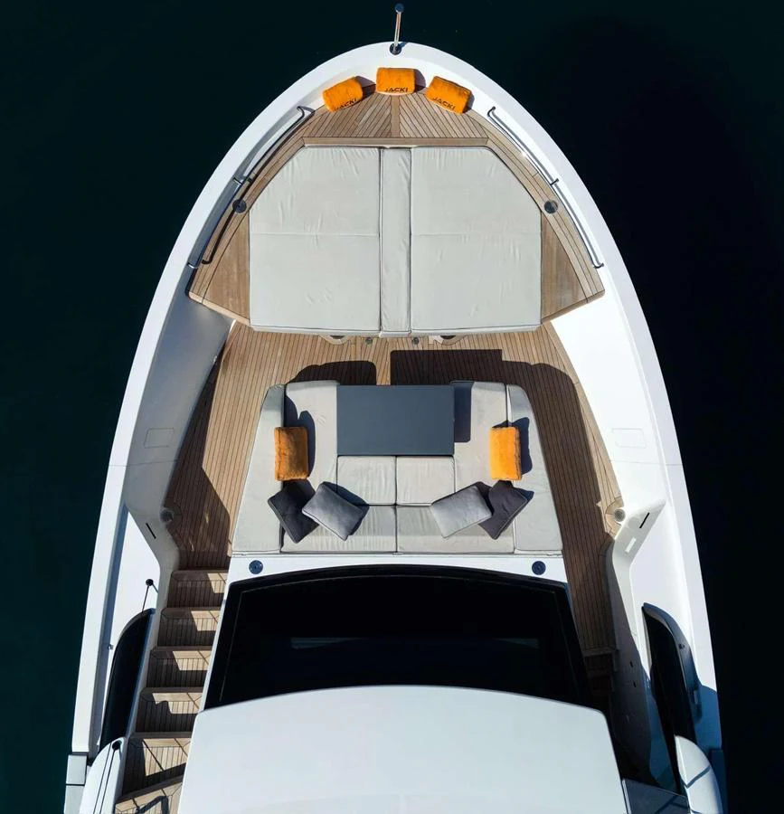 The foredeck features a spacious sunbathing area with plush cushions and vibrant accents. aboard SOLEDO Yacht for Sale