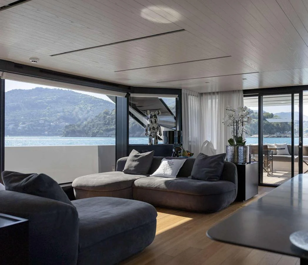 The salon offers a spacious and comfortable seating area with panoramic views of the surrounding waters. aboard SOLEDO Yacht for Sale