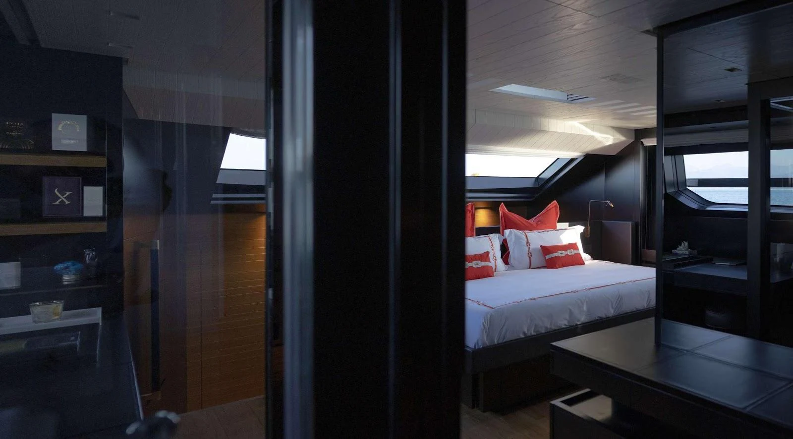 A luxurious stateroom with a large bed and modern decor bathed in natural light. aboard SOLEDO Yacht for Sale