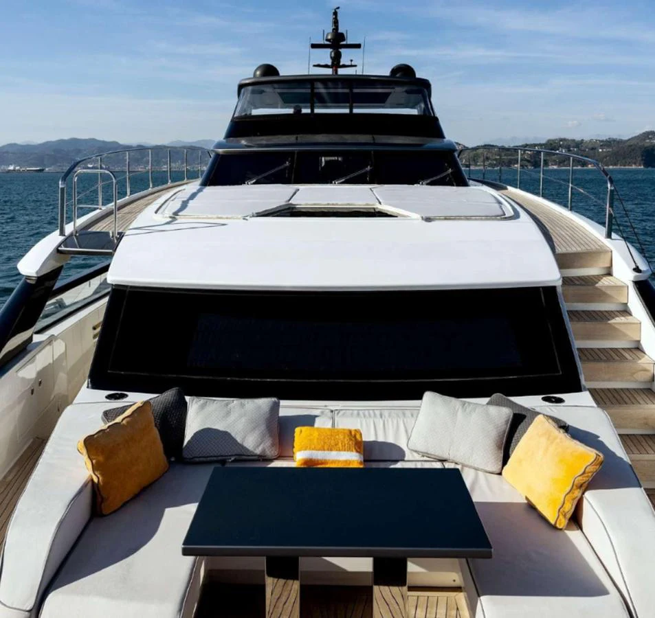 The foredeck features a luxurious seating area with plush cushions and a sleek table, perfect for relaxation and socializing. aboard SOLEDO Yacht for Sale