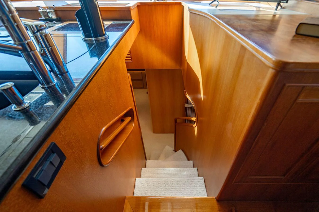 a wooden desk with a cell phone on it aboard NEVER BETTER Yacht for Sale
