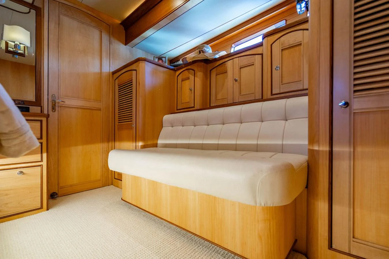 a room with a bed and cabinets aboard NEVER BETTER Yacht for Sale
