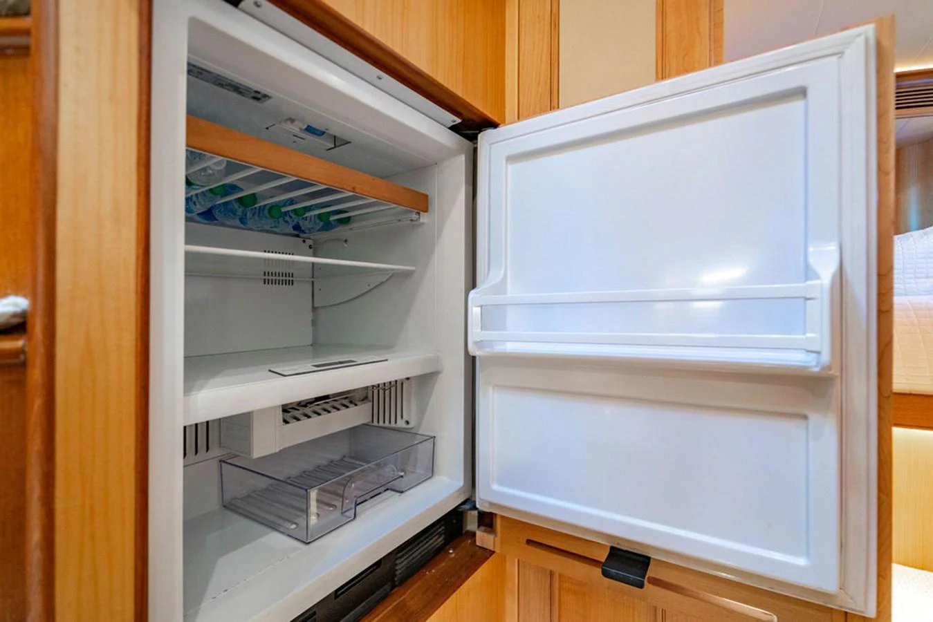 a white refrigerator with a door open aboard NEVER BETTER Yacht for Sale