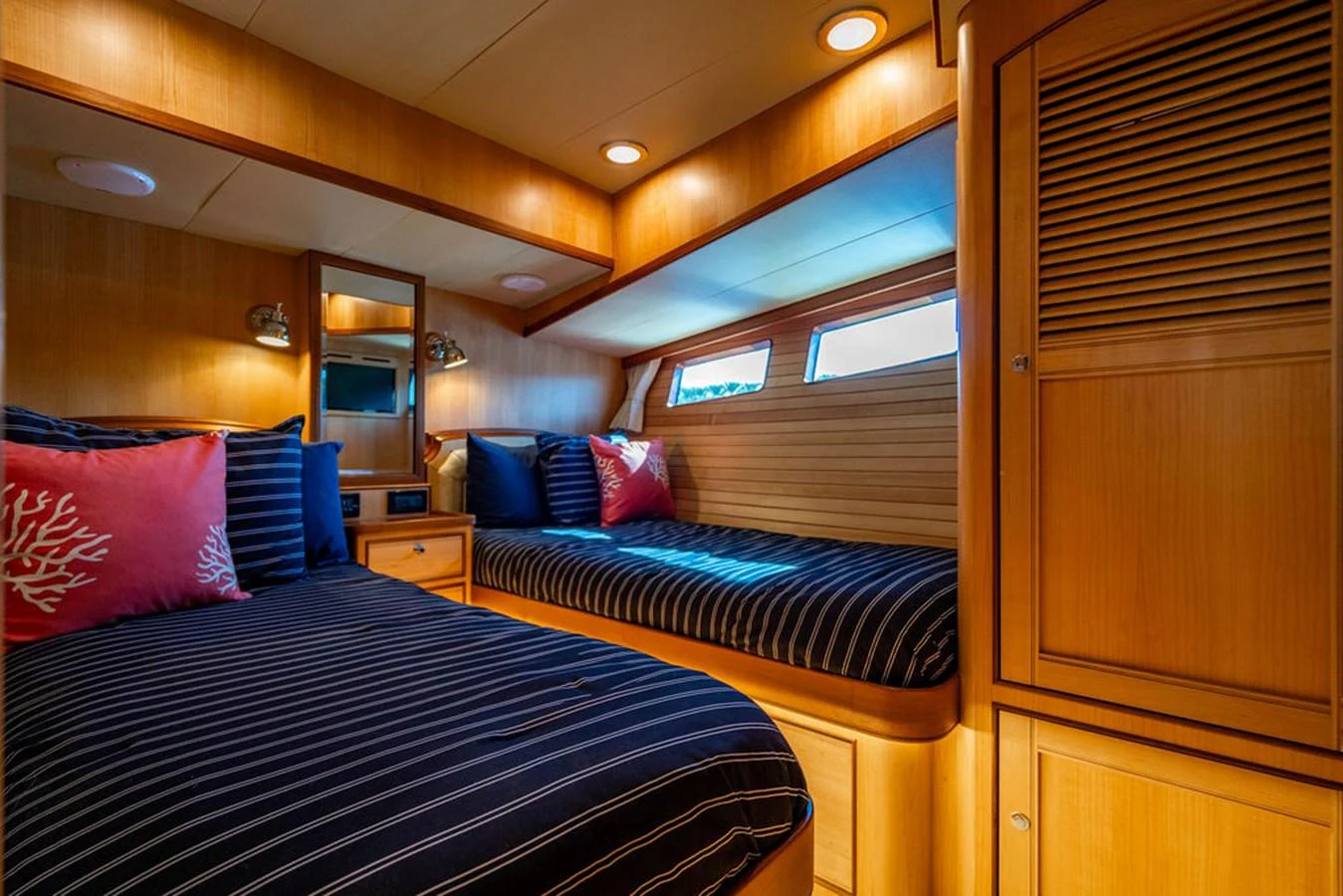 a bedroom with a bed and a window aboard NEVER BETTER Yacht for Sale
