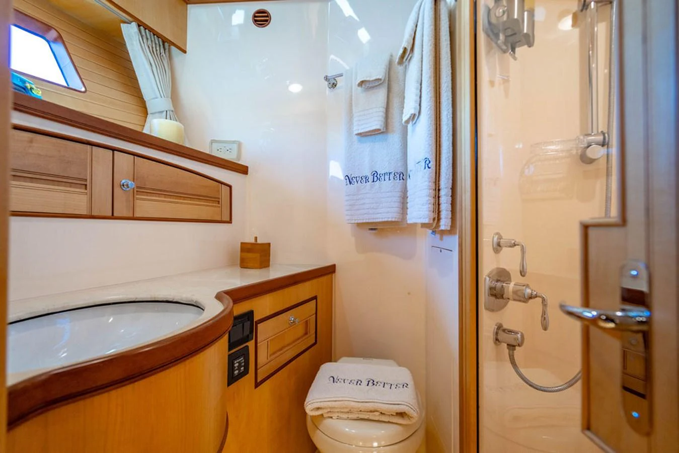 a bathroom with a toilet and sink aboard NEVER BETTER Yacht for Sale