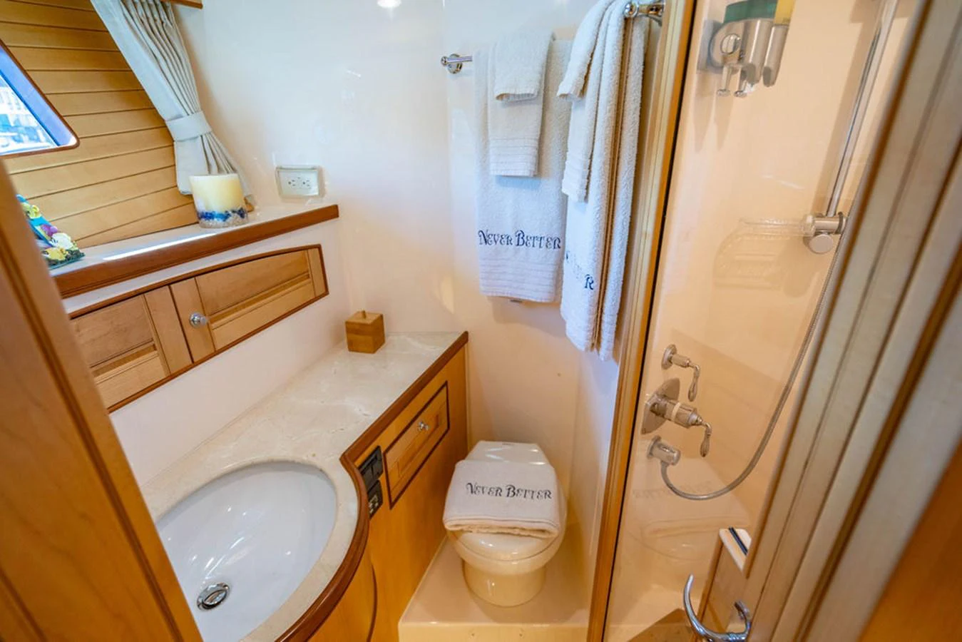 a bathroom with a toilet and sink aboard NEVER BETTER Yacht for Sale