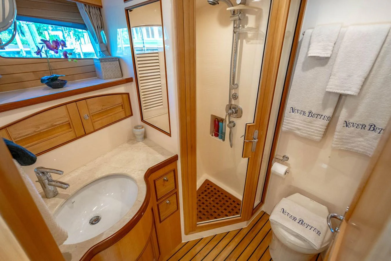 a bathroom with a sink and a shower aboard NEVER BETTER Yacht for Sale