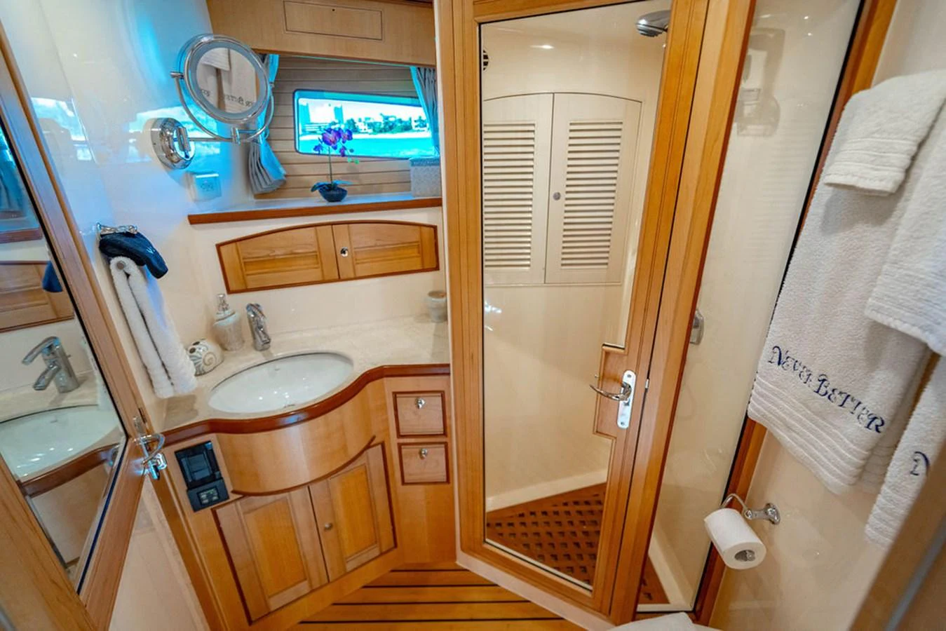 a bathroom with a sink and a tv aboard NEVER BETTER Yacht for Sale