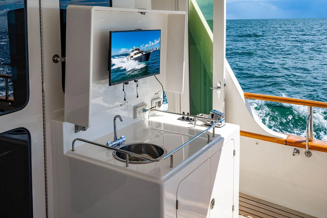 a boat with a large screen aboard NEVER BETTER Yacht for Sale