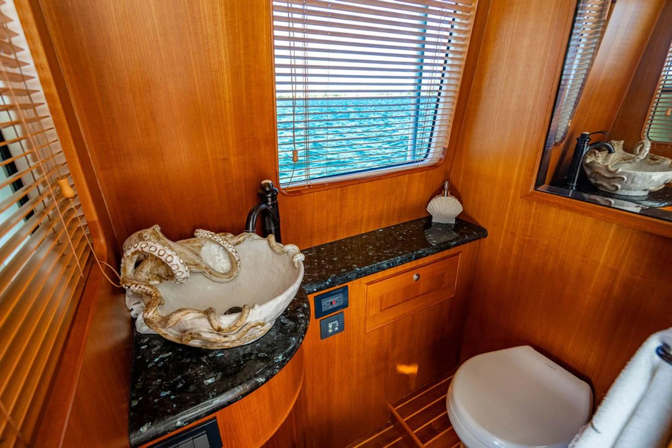 a bathroom with a sink and a toilet aboard NEVER BETTER Yacht for Sale