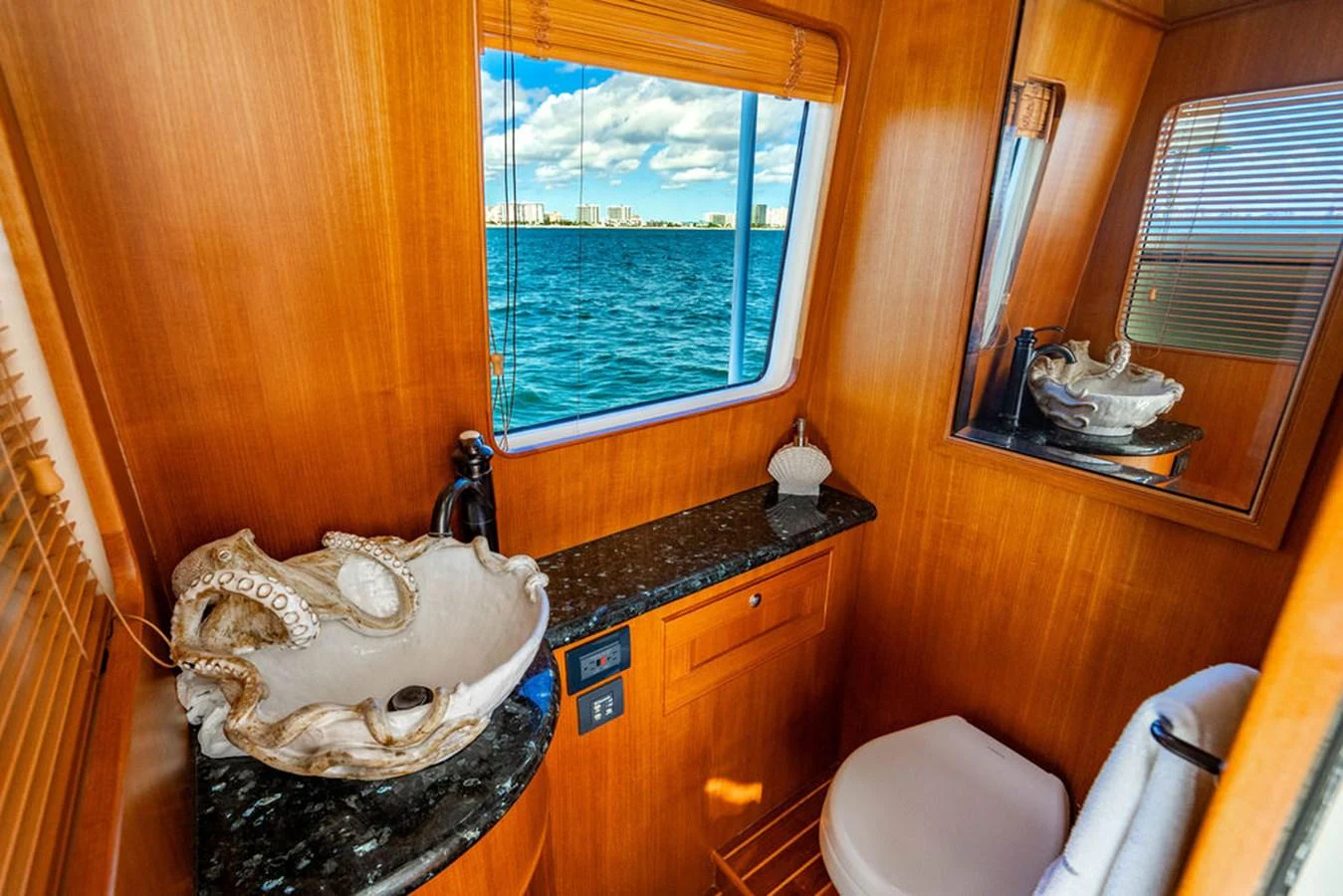 a bathroom with a large window aboard NEVER BETTER Yacht for Sale