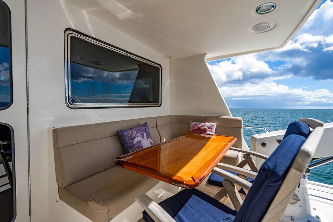 a room with a table and chairs aboard NEVER BETTER Yacht for Sale