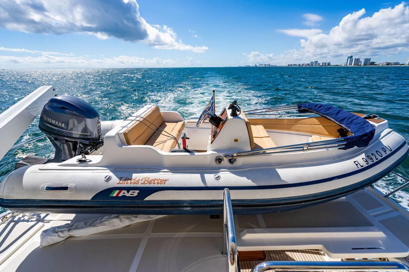 a boat with a motor attached to it aboard NEVER BETTER Yacht for Sale