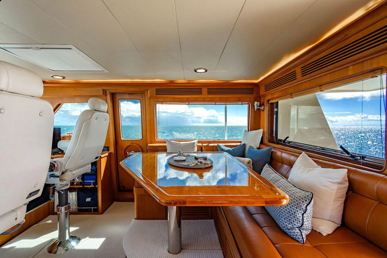 a room with a table and chairs aboard NEVER BETTER Yacht for Sale