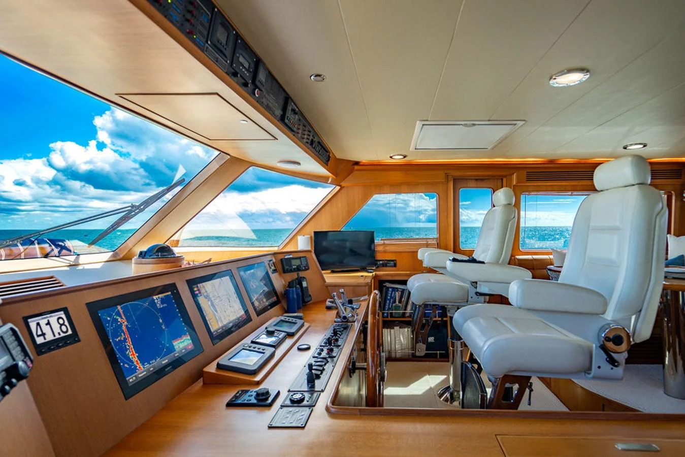 an airplane cockpit with a desk and chairs aboard NEVER BETTER Yacht for Sale