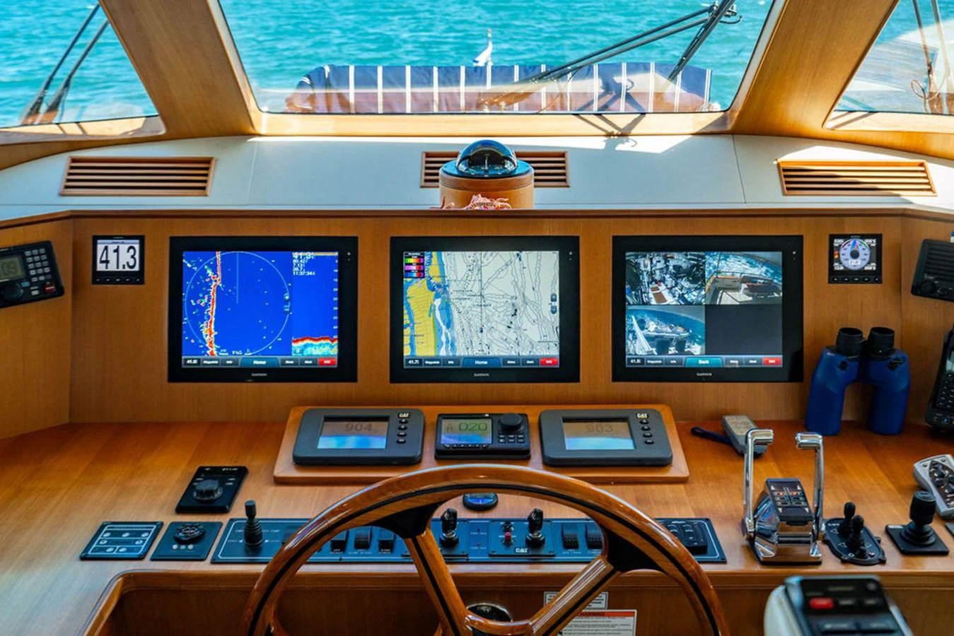 a room with many electronics and a television on the wall aboard NEVER BETTER Yacht for Sale