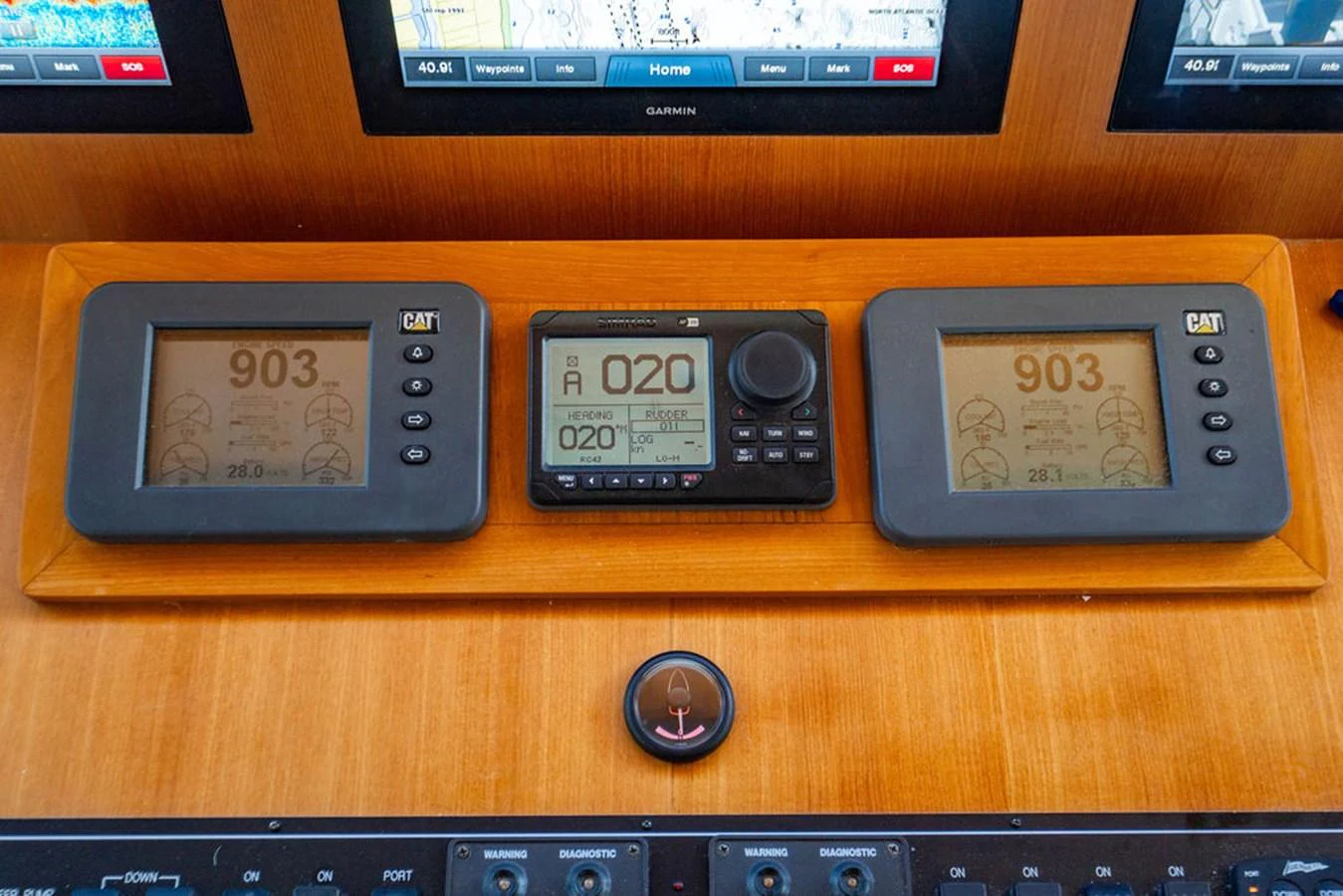 a couple of electronic devices on a table aboard NEVER BETTER Yacht for Sale