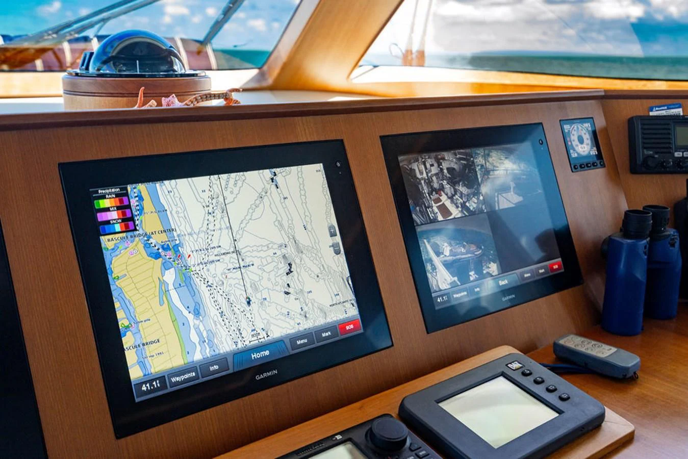 a desk with a computer and a phone on it aboard NEVER BETTER Yacht for Sale