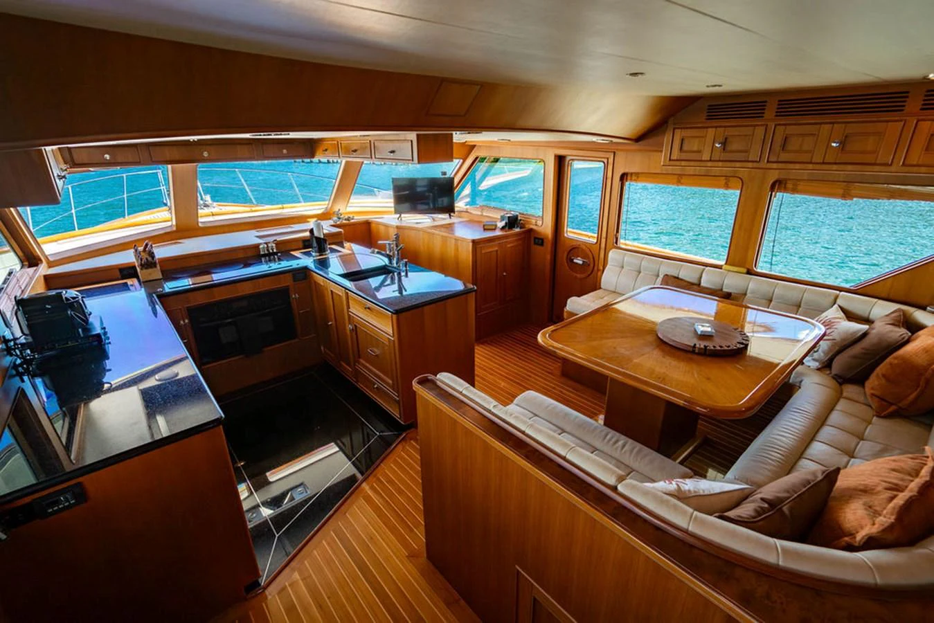 a room with a couch and a table aboard NEVER BETTER Yacht for Sale