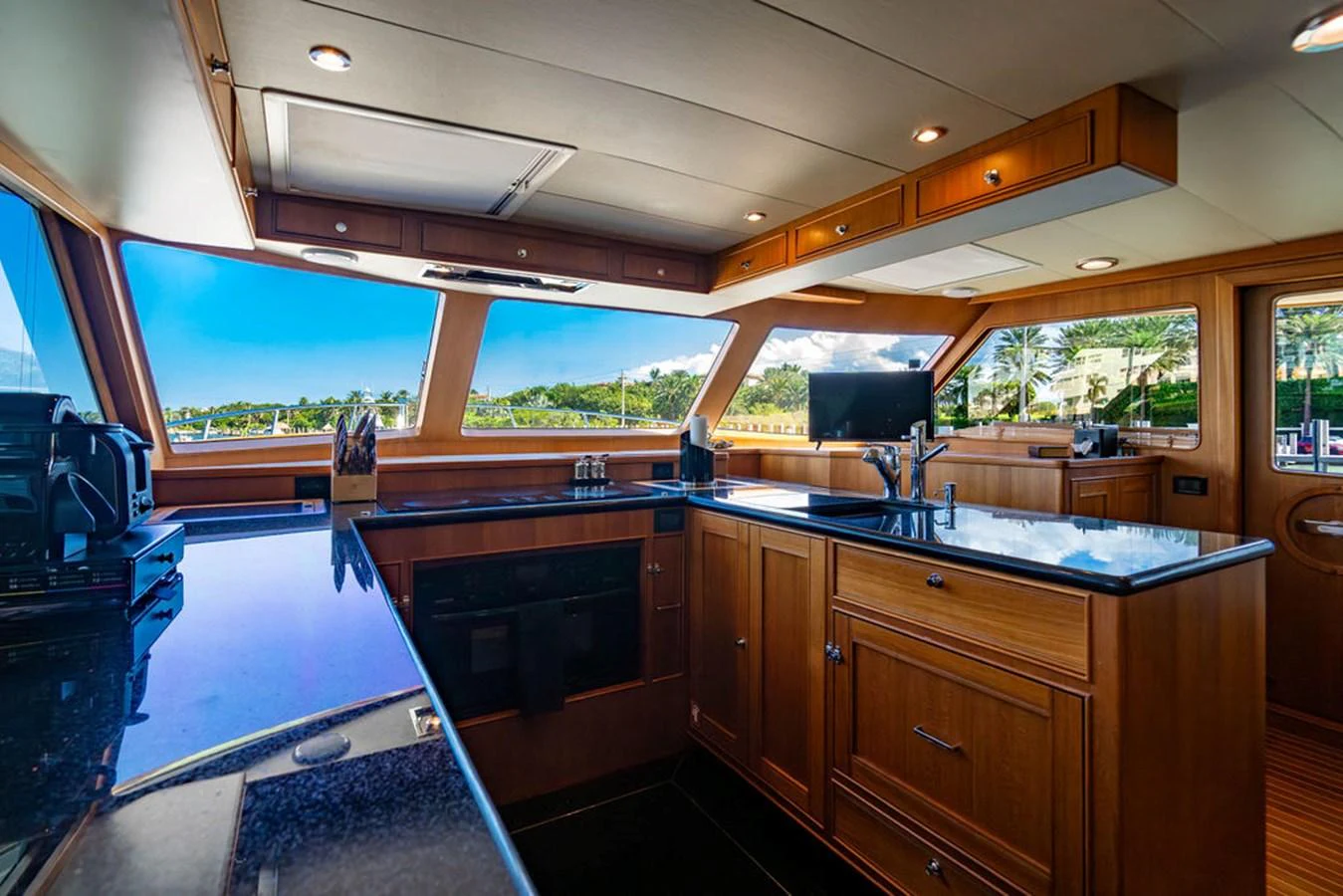 a kitchen with a large window aboard NEVER BETTER Yacht for Sale