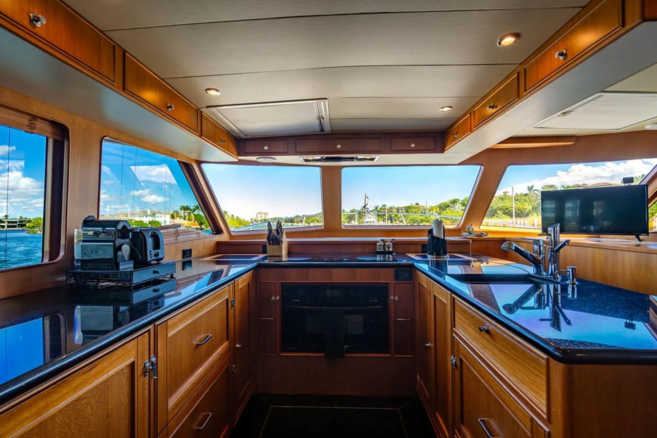 a kitchen with a large window aboard NEVER BETTER Yacht for Sale