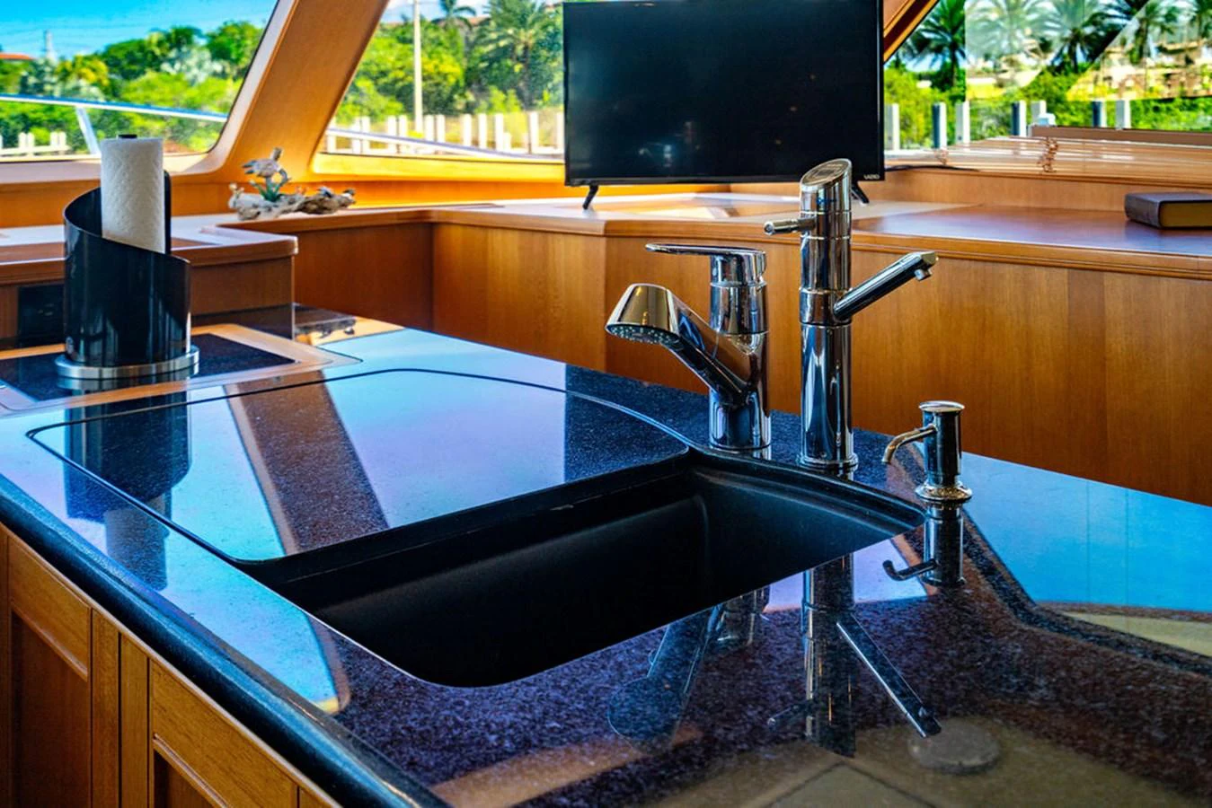 a kitchen sink with a large black faucet aboard NEVER BETTER Yacht for Sale