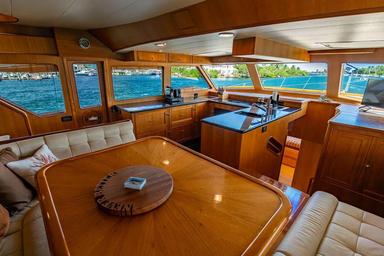 a large kitchen with a bar and bar aboard NEVER BETTER Yacht for Sale