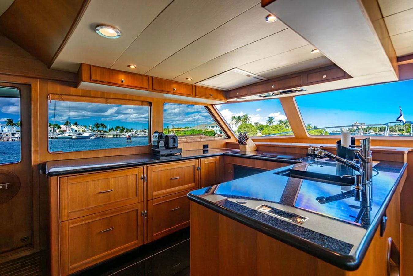 a kitchen with a large window aboard NEVER BETTER Yacht for Sale