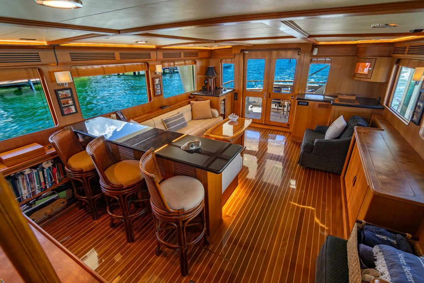 a room with a table chairs and a couch aboard NEVER BETTER Yacht for Sale