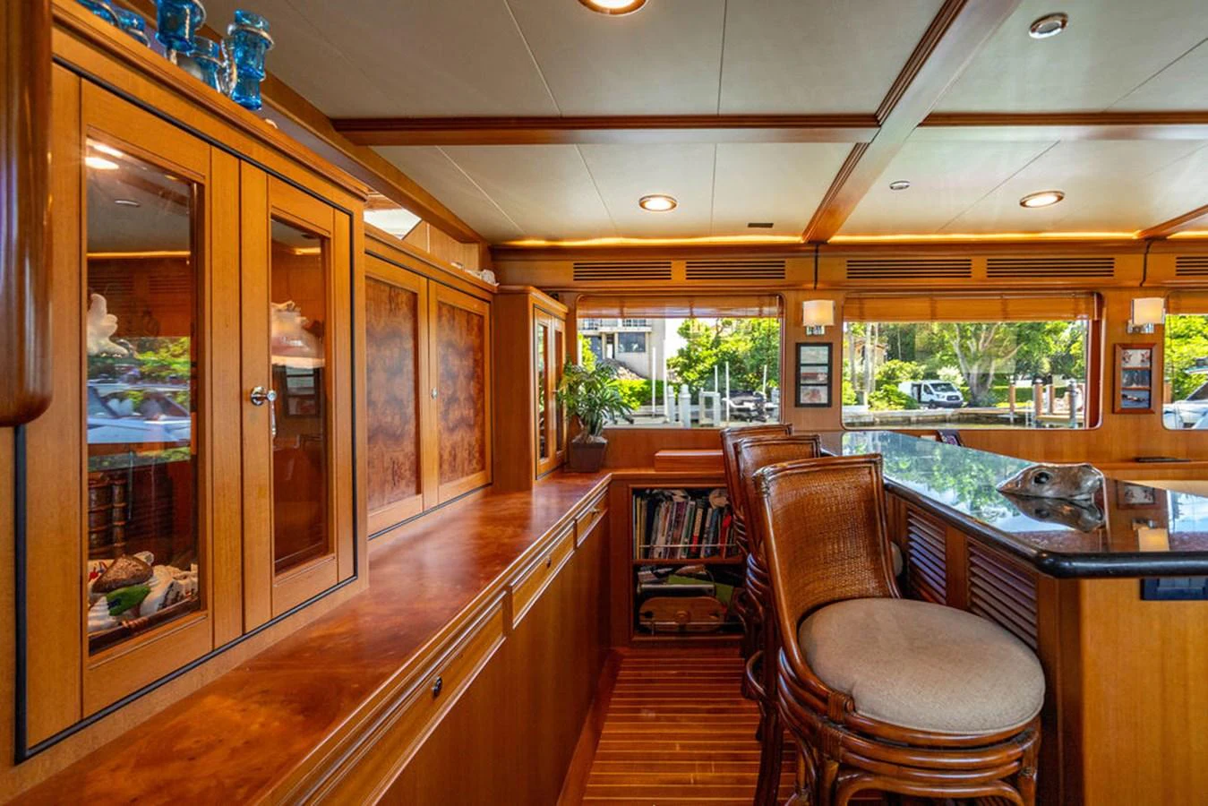 a room with a wood floor and a wood cabinet and a chair aboard NEVER BETTER Yacht for Sale