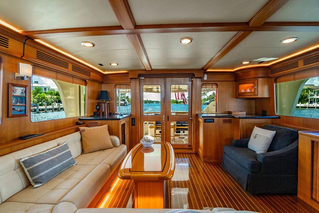 a living room with a wood floor aboard NEVER BETTER Yacht for Sale