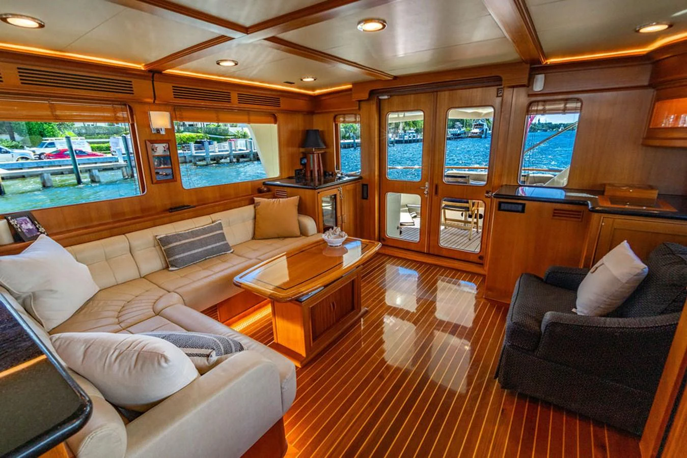 a living room with a wood floor aboard NEVER BETTER Yacht for Sale