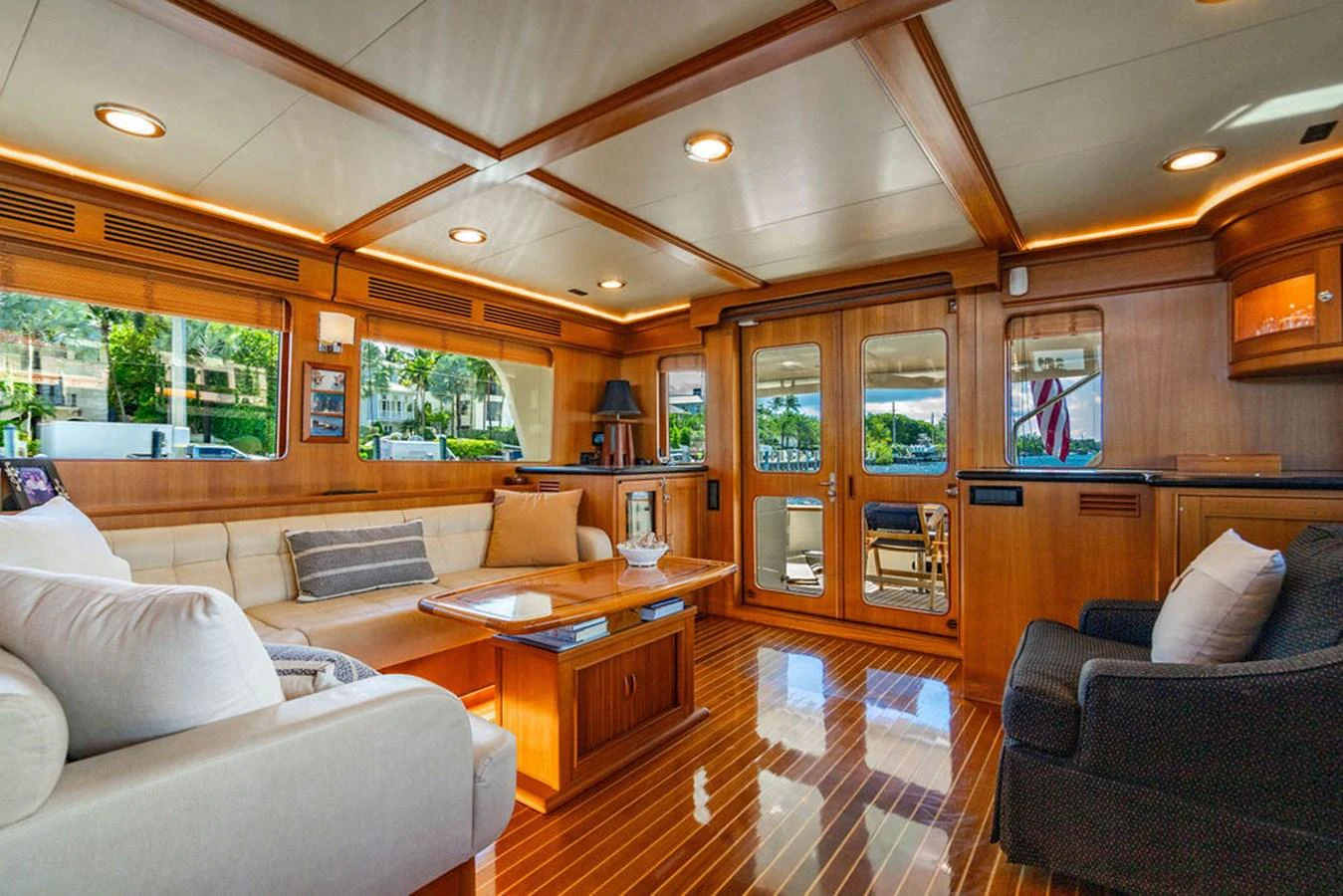 a living room with wood cabinets aboard NEVER BETTER Yacht for Sale
