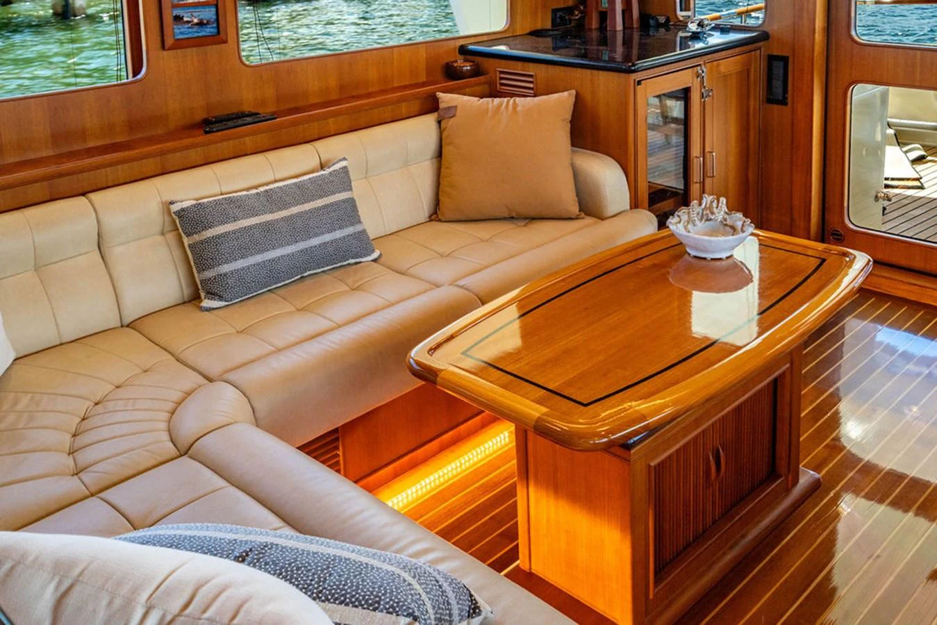 a couch and coffee table in a living room aboard NEVER BETTER Yacht for Sale